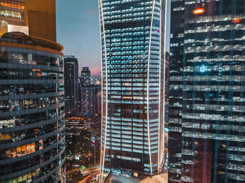 Modern buildings in city at night