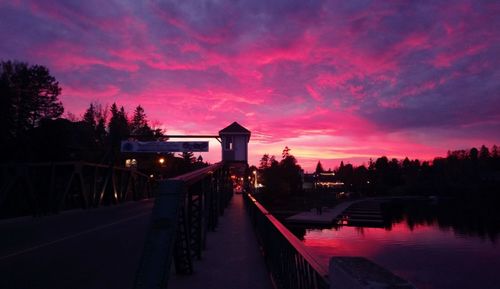 Scenic view of silhouette trees against sky at sunset