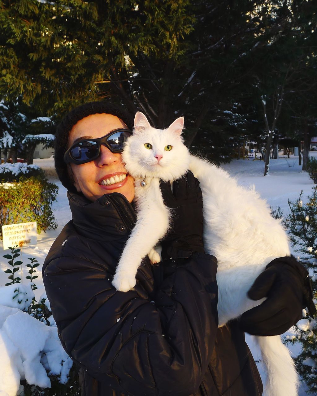 winter, snow, portrait, cold temperature, looking at camera, front view, lifestyles, white color, leisure activity, person, season, tree, young adult, warm clothing, headshot, day, outdoors, standing