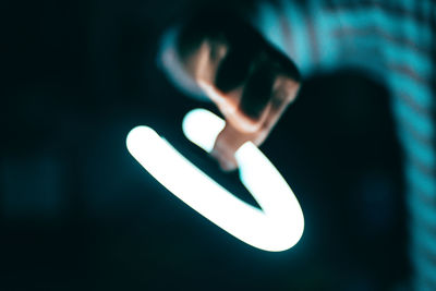 Close-up of hand holding illuminated light