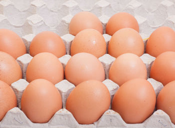 Close-up of eggs in carton on table