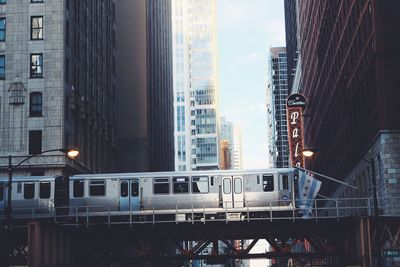 Low angle view of skyscrapers against sky in city