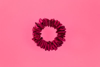 Close-up of pink flower against red background