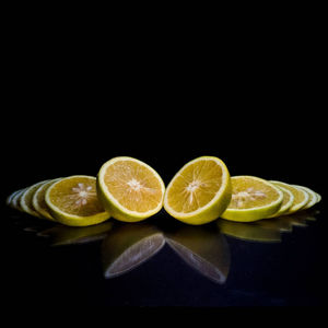 Close-up of fruits against black background