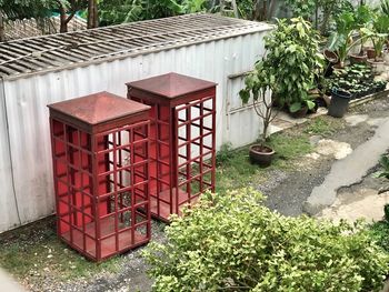 High angle view of potted plants in yard against building