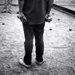 Low section of woman standing on tiled floor