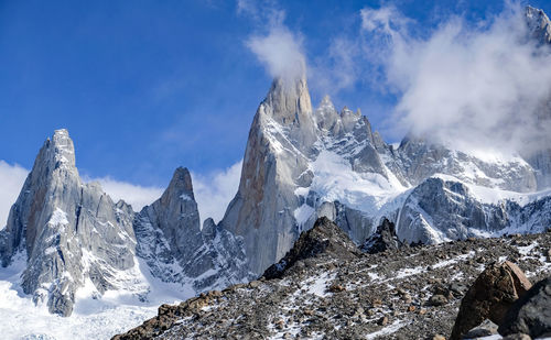 Panoramic view of snowcapped mountains against sky