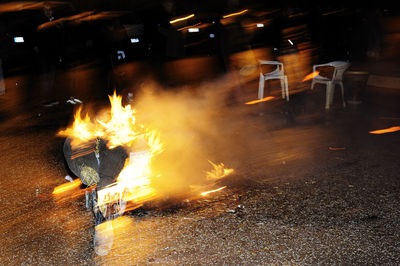 Close-up of fire burning at night