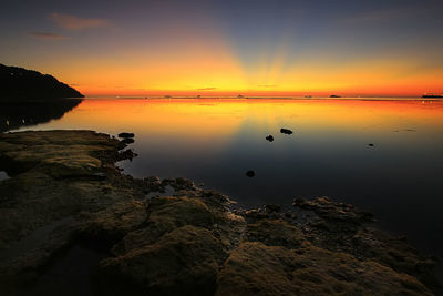 Scenic view of sea against sky during sunset