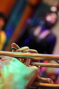 Close-up of person playing musical instrument