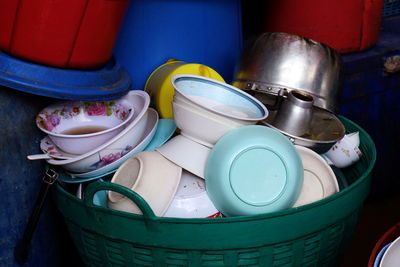High angle view of messy utensils in container