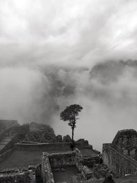 View of old ruin building against cloudy sky