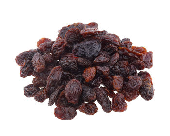 Close-up of dried fruits against white background