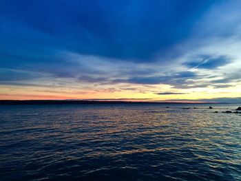 View of calm sea at sunset