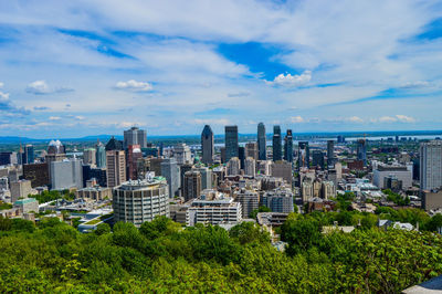 High angle view of city against cloudy sky