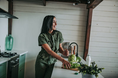 Woman standing at home