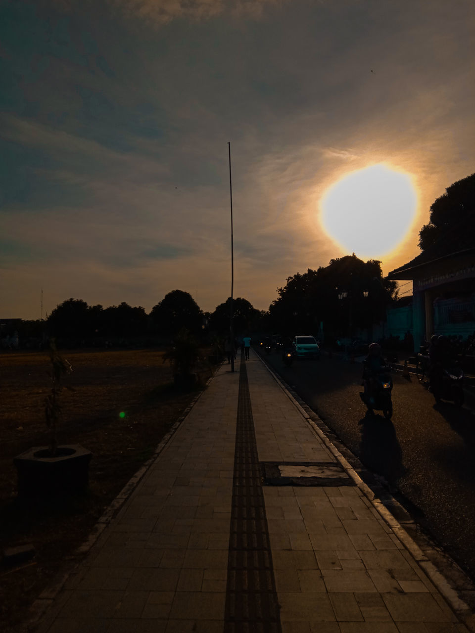 STREET IN CITY AT SUNSET