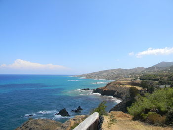 Scenic view of sea against blue sky