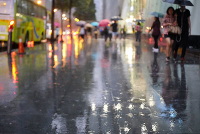 Group of people on wet road in rainy season