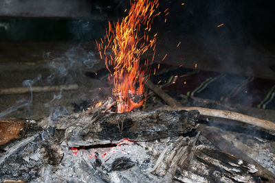 High angle view of fire on wood