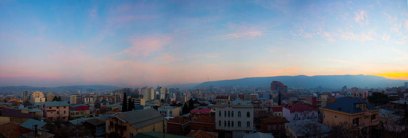 High angle shot of townscape against sky during sunset