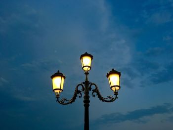 Low angle view of street light against sky