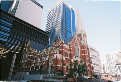 Low angle view of modern buildings against sky in city