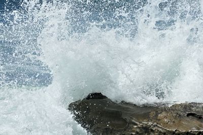 Waves splashing on rocks