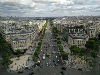 High angle view of traffic on road amidst buildings in city