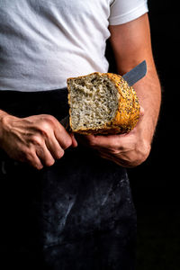 Midsection of man holding ice cream