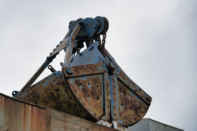 Low angle view of old ship against sky