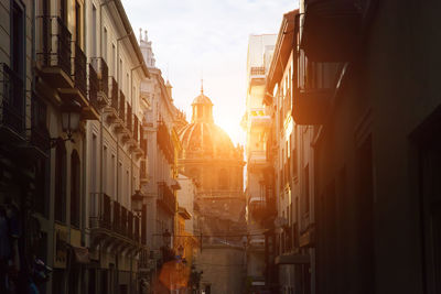 Panoramic view of buildings in city during sunset