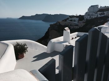 Scenic view of sea and buildings against sky