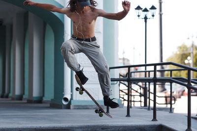 Low section of man skateboarding on skateboard