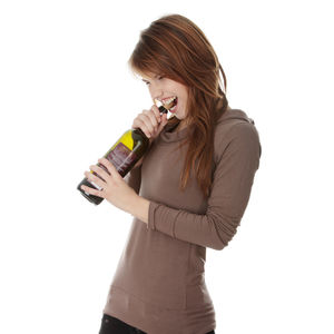 Young woman holding ice cream against white background