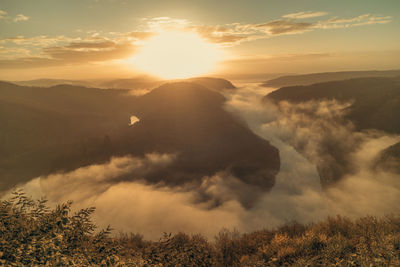 Scenic view of mountains against sky during sunset