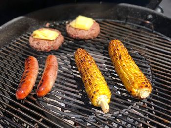 High angle view of meat on barbecue grill