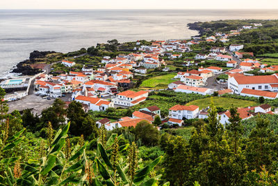 High angle view of townscape by sea