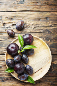 High angle view of fruits on wooden table