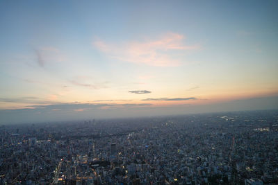 High angle view of city against sky during sunset