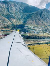 Aerial view of landscape and mountains against sky