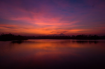 Scenic view of lake against romantic sky at sunset