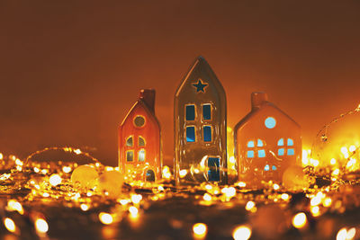 Illuminated buildings in city against sky at night