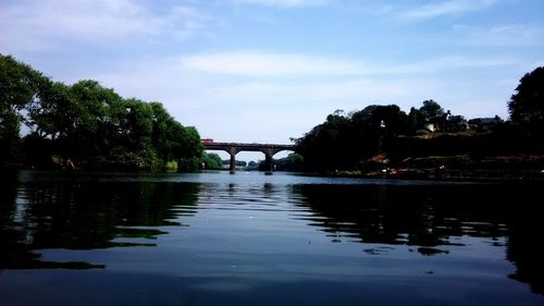 Scenic view of bridge over river against sky