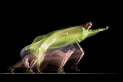 The runner moves between two permanent lights. at the end of the exposure, a flash makes him visible