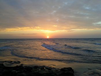 Scenic view of sea at sunset