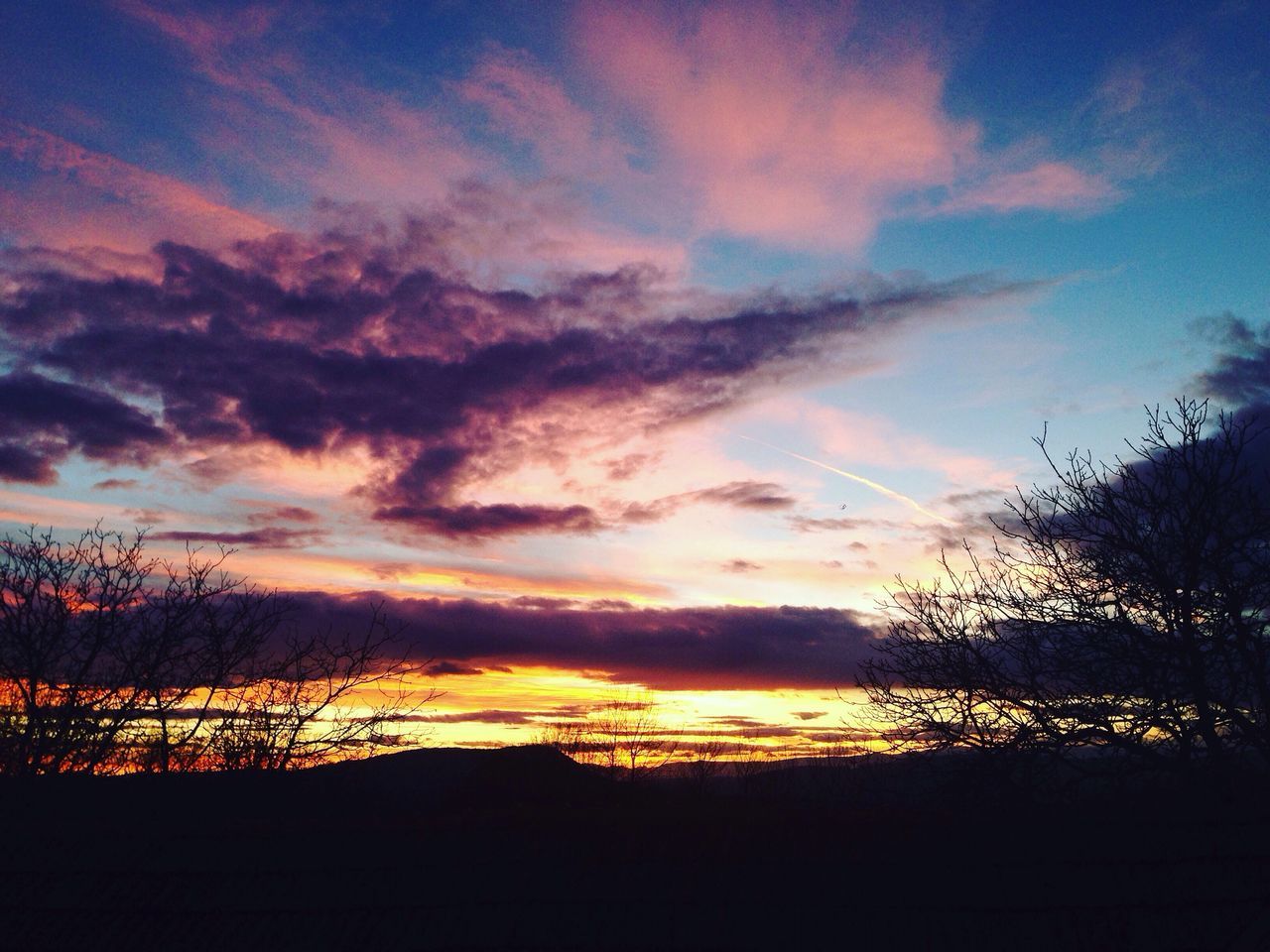 sunset, silhouette, sky, scenics, beauty in nature, tranquil scene, tranquility, orange color, cloud - sky, nature, idyllic, tree, cloud, dramatic sky, landscape, sun, outdoors, moody sky, majestic, outline