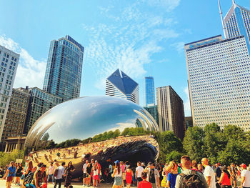 Panoramic view of modern buildings in city against sky