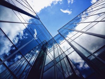 Low angle view of building against cloudy sky