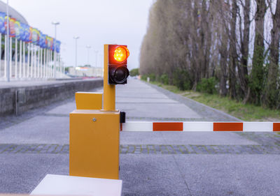 Traffic signal with road in background